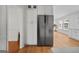 Open-concept kitchen with stainless steel refrigerator and plenty of natural light at 3332 St John Dr, East Point, GA 30344