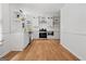 Updated kitchen featuring white cabinets, stainless steel appliances, and hardwood floors at 3332 St John Dr, East Point, GA 30344
