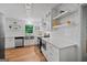 Bright kitchen features white cabinetry, stainless steel appliances, and an eat-in breakfast area at 3332 St John Dr, East Point, GA 30344