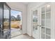 View of a home's entryway with light hardwood floors, white walls, and a door leading to the outside at 3614 Squires Park Ln, Loganville, GA 30052