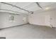 Spacious garage with windows and electric door at 3614 Squires Park Ln, Loganville, GA 30052