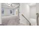Bright main bedroom with a tray ceiling, ceiling fan, and two large windows at 3614 Squires Park Ln, Loganville, GA 30052