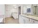 Bathroom features double vanities, granite countertop, and tile floor at 3623 Squires Park Ln, Loganville, GA 30052