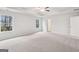 Bedroom features neutral carpet and two windows for natural light at 3623 Squires Park Ln, Loganville, GA 30052