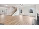 Bright and airy living room with hardwood floors, fireplace, and staircase at 3623 Squires Park Ln, Loganville, GA 30052