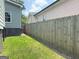 Fenced backyard with a grassy area and a peek at the neighbors home at 644 Albert Nw St, Atlanta, GA 30318