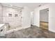 Stylish bathroom with tiled shower, a built-in bench, and an adjacent room at 644 Albert Nw St, Atlanta, GA 30318