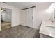 Bathroom features an elegant marble countertop with double sinks and a modern barn door at 644 Albert Nw St, Atlanta, GA 30318