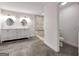 Bright bathroom features a double sink vanity, tiled shower and separate toilet space at 644 Albert Nw St, Atlanta, GA 30318