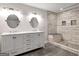Bathroom showcasing a double vanity, tile floor, and walk-in shower at 644 Albert Nw St, Atlanta, GA 30318