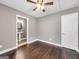 Bedroom featuring hardwood floors, gray paint, and a glimpse into the attached bathroom at 644 Albert Nw St, Atlanta, GA 30318