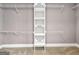 Walk-in closet boasts ample storage with shelving and hanging rods at 644 Albert Nw St, Atlanta, GA 30318