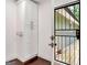 Hallway area with white pantry and access to the backyard through a door with a metal screen at 644 Albert Nw St, Atlanta, GA 30318