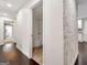 Hallway that leads into a bathroom with a tiled shower/tub combo at 644 Albert Nw St, Atlanta, GA 30318