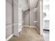 Walk-in closet with built-in shelves and gray walls at 644 Albert Nw St, Atlanta, GA 30318