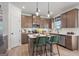 The kitchen features an island, updated appliances, hardwood floors, and modern cabinetry at 2 Silver Leaf Trl, Douglasville, GA 30134