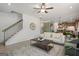 Open concept living space with staircase, fireplace, kitchen and living area at 2 Silver Leaf Trl, Douglasville, GA 30134