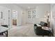 Spacious loft area showcasing a comfortable chair and access to the bathroom at 2 Silver Leaf Trl, Douglasville, GA 30134
