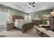 Stately main bedroom featuring a trey ceiling, green walls, ceiling fan, and sitting area at 2 Silver Leaf Trl, Douglasville, GA 30134