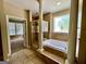 Bathroom showcasing a soaking tub, glass shower, and decorative window at 345 Peaceful Way, Fayetteville, GA 30214