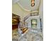Elegant foyer boasting a curved staircase, marble flooring, and views of formal spaces at 345 Peaceful Way, Fayetteville, GA 30214