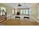 Comfortable living room featuring a stone fireplace, neutral carpet, and an abundance of natural light at 345 Peaceful Way, Fayetteville, GA 30214