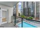 Balcony overlooks the complex swimming pool and cityscape at 1280 W Peachtreestreetsuffix=Street Nw # 808, Atlanta, GA 30309