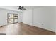 Spacious bedroom featuring a ceiling fan, sliding glass doors and luxury vinyl flooring at 1280 W Peachtreestreetsuffix=Street Nw # 808, Atlanta, GA 30309