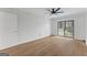 Bright bedroom featuring a ceiling fan, closet and sliding glass doors to the balcony at 1280 W Peachtreestreetsuffix=Street Nw # 808, Atlanta, GA 30309