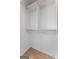 Walk-in closet features built-in shelving and closet rods at 1280 W Peachtreestreetsuffix=Street Nw # 808, Atlanta, GA 30309