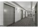 Modern elevator lobby with carpet flooring, gray walls, and recessed lighting at 1280 W Peachtreestreetsuffix=Street Nw # 808, Atlanta, GA 30309