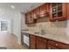 Kitchen featuring granite countertops, stainless steel appliances, wood cabinets and tile backsplash at 1280 W Peachtreestreetsuffix=Street Nw # 808, Atlanta, GA 30309