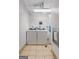 Clean laundry room with modern machines and tile flooring at 1280 W Peachtreestreetsuffix=Street Nw # 808, Atlanta, GA 30309