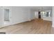 Open-concept living space with updated flooring, large windows, and a view into the adjoining kitchen at 1280 W Peachtreestreetsuffix=Street Nw # 808, Atlanta, GA 30309