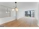 The spacious living room features modern lighting, updated flooring, and expansive windows with cityscape views at 1280 W Peachtreestreetsuffix=Street Nw # 808, Atlanta, GA 30309
