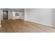 Spacious living room with luxury vinyl flooring, modern lighting, and mirror accent wall at 1280 W Peachtreestreetsuffix=Street Nw # 808, Atlanta, GA 30309