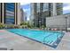 Gorgeous swimming pool with lounge chairs and buildings in the background at 1280 W Peachtreestreetsuffix=Street Nw # 808, Atlanta, GA 30309