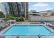 Stunning swimming pool area with lounge chairs and city views at 1280 W Peachtreestreetsuffix=Street Nw # 808, Atlanta, GA 30309