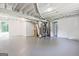 Unfinished basement with concrete floors, exposed ceiling, and white-painted walls, ready for customization at 1349 Heather Cir, Riverdale, GA 30296