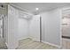 Finished basement with closet, open space, and a view into renovated bathroom at 1349 Heather Cir, Riverdale, GA 30296