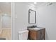 Stylish half bath featuring a modern vanity with a square mirror and grey walls at 1349 Heather Cir, Riverdale, GA 30296