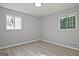 This bedroom features two windows letting in plenty of natural light at 1349 Heather Cir, Riverdale, GA 30296