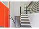 View of the entryway and stairs featuring modern railing and freshly painted walls and trim at 1349 Heather Cir, Riverdale, GA 30296