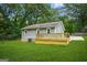 Backyard with deck and green grass at 1675 White Oak Way, Decatur, GA 30032