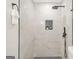 Modern bathroom showcasing a luxurious tile shower with rainfall shower head and neutral decor at 1675 White Oak Way, Decatur, GA 30032