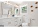 Elegant bathroom with double vanity, modern lighting, and stylish fixtures at 1675 White Oak Way, Decatur, GA 30032