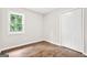 Bright bedroom with closet and a large window at 1675 White Oak Way, Decatur, GA 30032