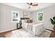 Bright bedroom with hardwood floors, ceiling fan, area rug, and plenty of natural light at 1675 White Oak Way, Decatur, GA 30032
