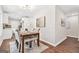 Bright dining area with a stylish table and chairs, leading to a modern kitchen at 1675 White Oak Way, Decatur, GA 30032