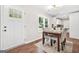 Bright dining area featuring a table for four, ample natural light, and hardwood floors at 1675 White Oak Way, Decatur, GA 30032